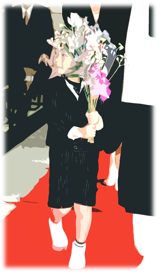 こどもが花をお供えしています