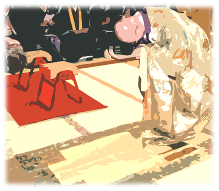 導師がご本尊さまに向かって三拝しています。